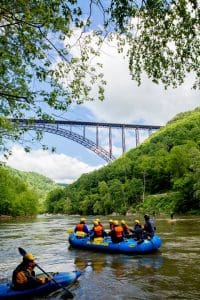 Paddlers gather near New River Gorge Bridge