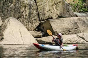 A kayaker explores boulders in the Dries of New River.