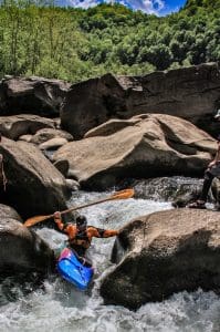 A kayaker descends through a chute in the Dries of New River.