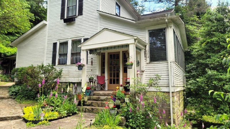 Flowers grow in profusion around the Garvey House at Winona, West Virginia, in the New River Gorge.
