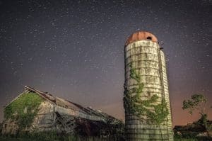 Stars travel the sky above a barn near Apple Grove.