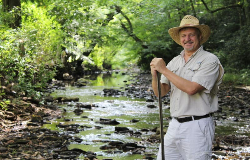 David Sibray pauses along a mountain stream. West Virginia Explorer founder and publisher David Sibray