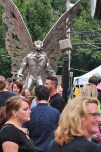 A metal sculpture of Mothman watches over crowds during the annual Mothman Festival at Point Pleasant, West Virginia.