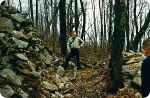 Archaeologists examine Wall No. 3 at the Mount Carbon Stone Walls site on March 27, 1961. Photo courtesy Grave Creek Mound Archaeological Complex.