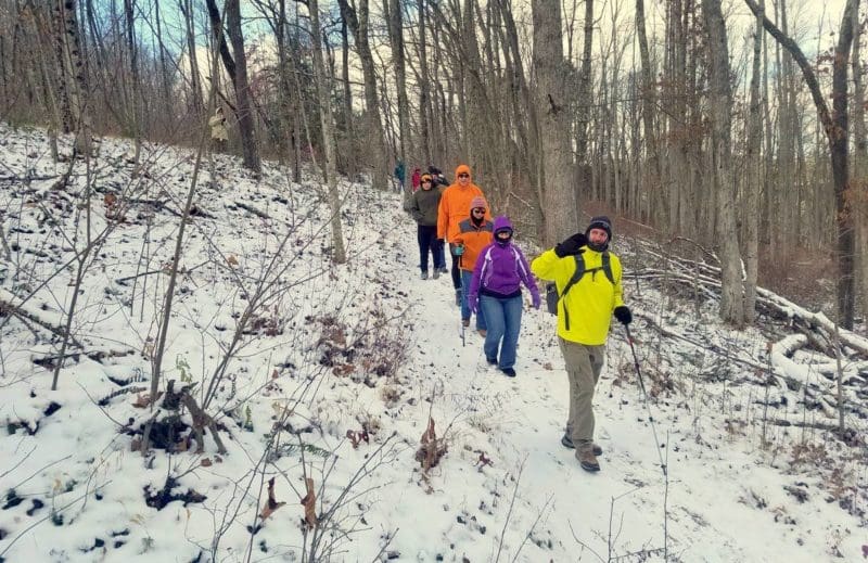 Levi Moore leads a winter hike through the woods in southern West Virginia.