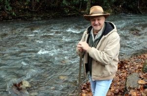 David Sibray, editor and publisher of West Virginia Explorer, explores a mountain stream.