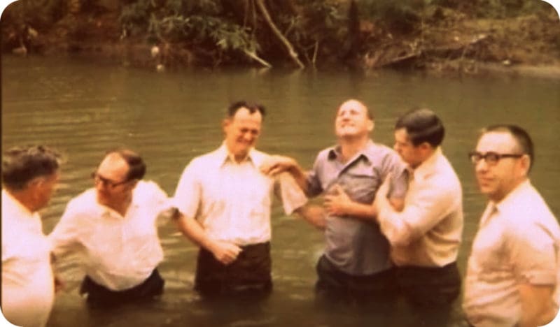 The father of Shirley Stewart Burns is baptized in southern West Virginia.