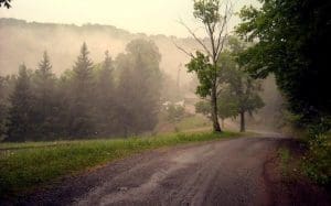 Fog rises off Keener Ridge in the hills above Strange Creek in Braxton County.
