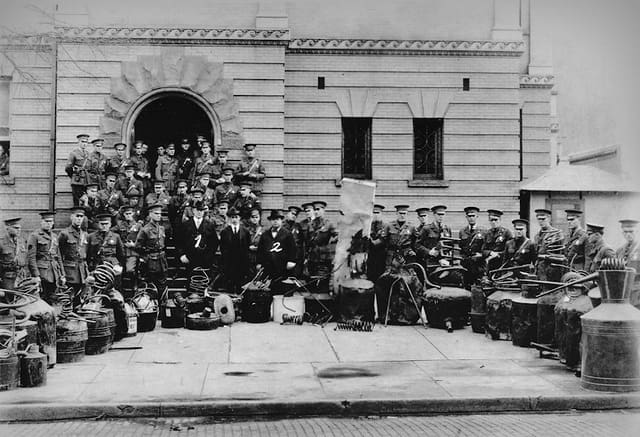 State Police officers father around a collection of confiscated stills at the old Mingo County courthouse.