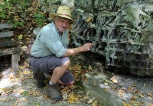 David Sibray explores boulders along the Honeycomb Rocks Trail in Pocahontas County, near Marlinton, West Virginia.