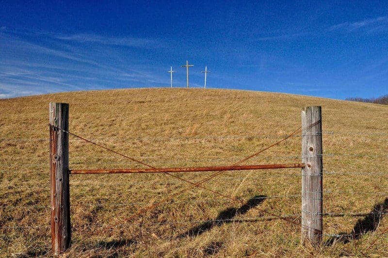Three crosses rise in a West Virginia pasture.
