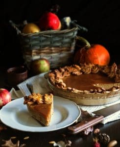 Pumpkin pie sits ready on a sideboard.
