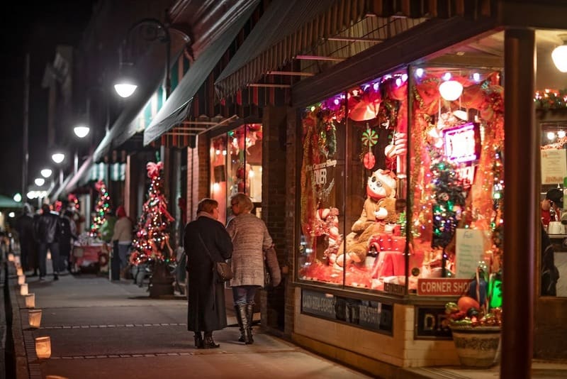 Visitors tour a line of decorated shops during the Bramwell Christmas Tour of Homes. (Photo: Mercer County CVB)