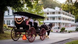 A horse-drawn carriage tours the historic ground of Capon Springs Resort.