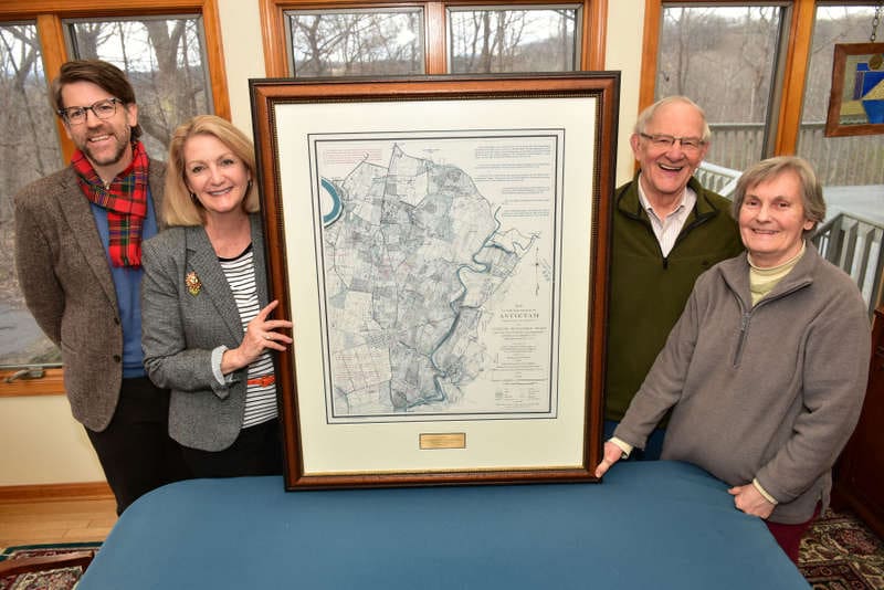 Dr. James Broomall and Monica Lingenfelter flank a map with Bill and Bonnie Stubblefield.