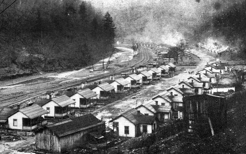 Camp houses line a road along Mate Creek in Mingo County, West Virginia.