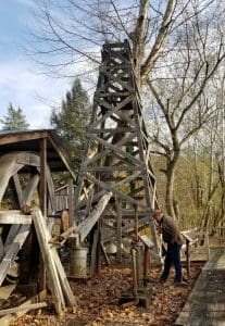 Historian David Sibray explores the restored oil well at Burning Springs, West Virginia.