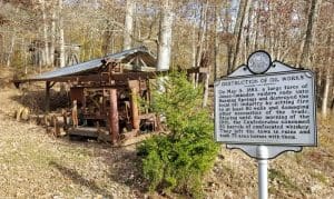 A historic marker at Burning Springs reveals more of the tale of the community's destruction.