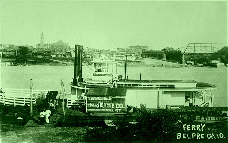 The Nina Paden docks at Belpre, Ohio. Parkersburg, with its tall courthouse tower, lines the Ohio River in the background.