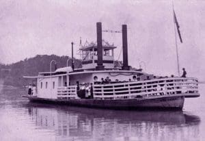 Passengers line the bow of the Nina Paden as it ferries across the Ohio River near Parkersburg, West Virginia.