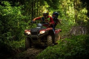 ATV riders navigate a muddy trail in the mountains of southern West Virginia.