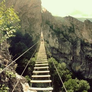 Lilly Bias challenges the via ferrata at Nelson Rocks.