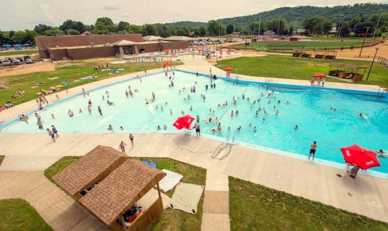 Visitors cavort in the wave pool at the Waves of Fun waterpark at Hurricane, West Virginia.