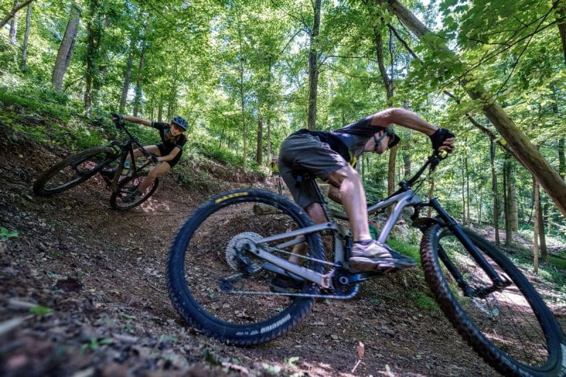 Tracy Toler and his daughter bike a forest trail in southern West Virginia.
