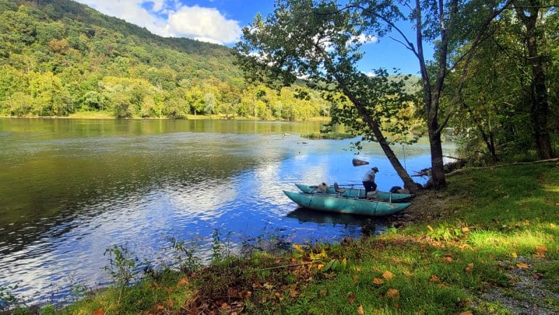 Fishing guide Bill Handy prepares to launch onto the upper New River on an early fall day.