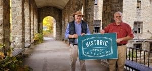 Foxfire Realty agents David Sibray (left) and Randy Burdette prepare for an open house at the Itmann Company Store.
