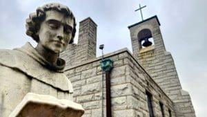 A statue of Saint Anthony of Padua stands outside Saint Anthony's Shrine at Boomer, West Virginia .