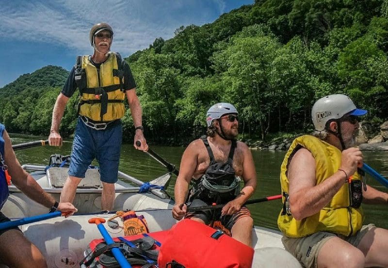 Paul Breuer guides whitewater raft Paul Breuer guides a whitewater raft through the New River Gorge