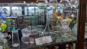 Glass toilet tank floats earn a cabinet in the American Museum of Glass in West Virginia.