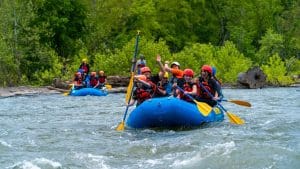 Whitewater rafters and kayakers paddle the Shenandoah River.