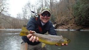 Biologist Glenn Nelson displays a trophy catch. 