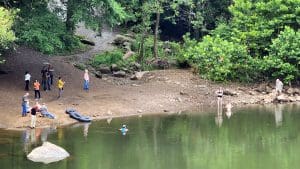 Visitors stroll along the banks of the New River at Fayette Station. 