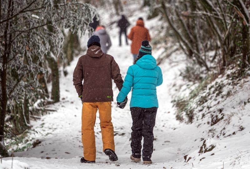 Hikers Walk A Snowy Trail in West Virginia