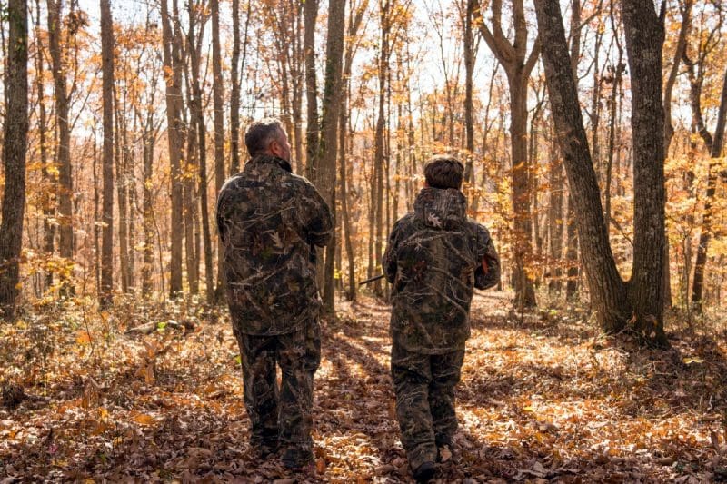 Hunters walk in a West Virginia woodland