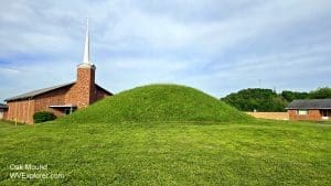 The larger of the two Oak Mounds rises in front of the Oakmound Evangelical Church near Clarksburg, West Virginia.