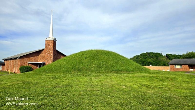 The larger of the two Oak Mounds rises in front of the Oakmound Evangelical Church near Clarksburg, West Virginia.