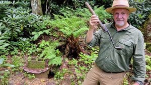 Farm for sale! David Sibray ladels fresh water out of a spring at the McKinney Homestead on Barkers Creek.