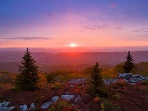 The morning sun rises above the autumn landscape at Dolly Sods.