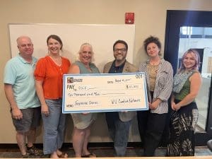 Organizers celebrate the receipt of funding from the W.Va. Creative Network. From left: Shawn Means, volunteer; Amy McLaughlin, volunteer; PJ Stevenson, Fayette County Community Foundation; Robby Moore, West Virginia Creative Network; Kate Kistler, volunteer; Kristin Carroll, volunteer. Shawn Means, volunteer; Amy McLaughlin, volunteer; PJ Stevenson, Fayette County Community Foundation; Robby Moore, West Virginia Creative Network; Kate Kistler, volunteer; Kristin Carroll, volunteer.