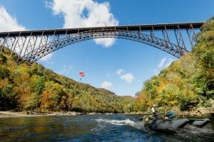 West Virginia famous: Parachutists leap from the span of the New River Gorge on Bridge Day.